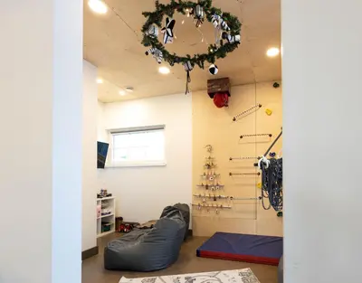 a room with a christmas tree on the wall at Vilnius legends house APARTMENT I Best for families I Free parking in Vilnius