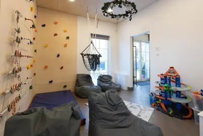 a room with a rock wall and a climbing wall at Vilnius legends house APARTMENT I Best for families I Free parking in Vilnius