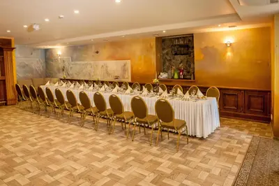 a row of tables and chairs in a room at Patalpų nuoma Žasliuose in Žasliai
