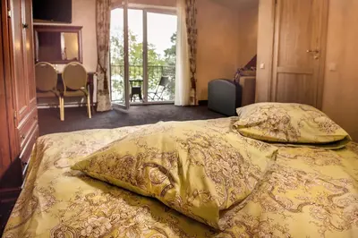 a bedroom with a bed with two pillows on it at Patalpų nuoma Žasliuose in Žasliai