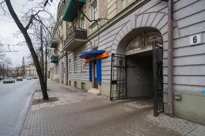 a building with an open door with a frisbee at Islandijos Self Check-In Basement Apartments in Vilnius