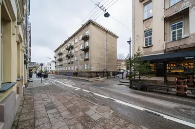 an empty street in a city with buildings at Islandijos Self Check-In Basement Apartments in Vilnius