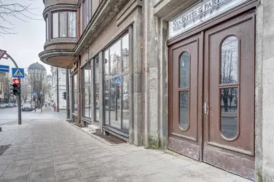 a building with windows on the side of a street at Funky Penthouse City Center in Kaunas