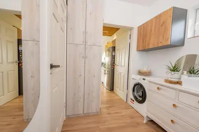 a laundry room with a washer and dryer at Poilsio oazė in Vynupė