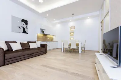 a living room with a couch and a table at Center Avenue Apartments in Vilnius