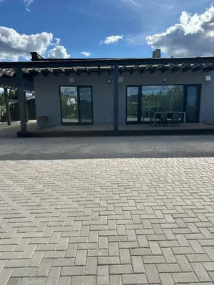a building with a bench in front of it at IG House in Druskininkai