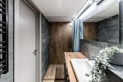 a bathroom with a sink and a mirror at Modern Urban loft in Vilnius