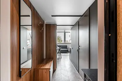 a hallway of a house with a mirror at Modern Urban loft in Vilnius