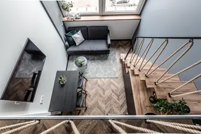 an overhead view of a living room with stairs at Modern Urban loft in Vilnius