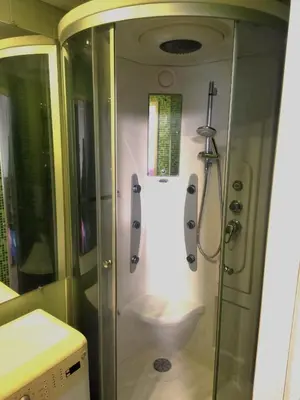 a bathroom with a shower and a toilet at ITAJA apartment 66 in Šiauliai