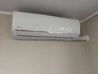 a white appliance is hanging from a ceiling at ITAJA apartment 66 in Šiauliai