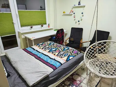 a room with a swing and two chairs at HOME20GEDV in Vilnius