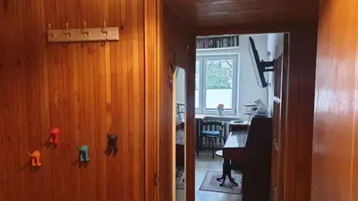 a room with a wooden wall with animal magnets on it at HOME20GEDV in Vilnius