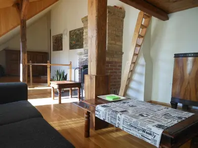 a living room with a couch and a table at Daukanto Apartments in Vilnius