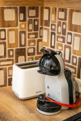 a toaster sitting on top of a counter at NK apartments in Druskininkai
