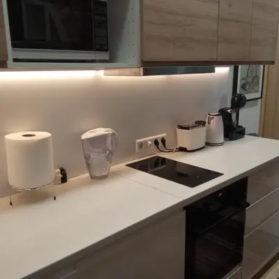 a kitchen counter with a sink and a microwave at L studio in Kaunas
