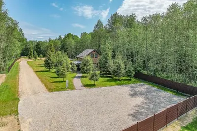 an aerial view of a driveway with trees at Zalesossodyba in Purnuškis