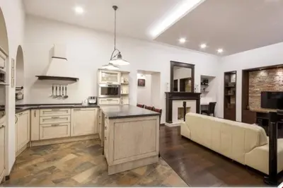 a kitchen with a couch and a table in a room at HaPPy iNN ToTo Old Town, Self check, Parking in the yard, in Vilnius