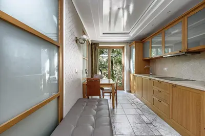 a kitchen with a bench in the middle of a room at Jacuzzi apartments x Free parking x SELF CHECK-IN 24x7 by H&H in Vilnius