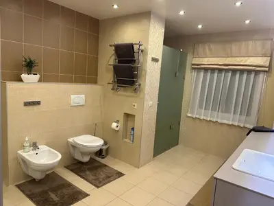 a bathroom with a toilet and a sink at Apartamentai in Marijampolė