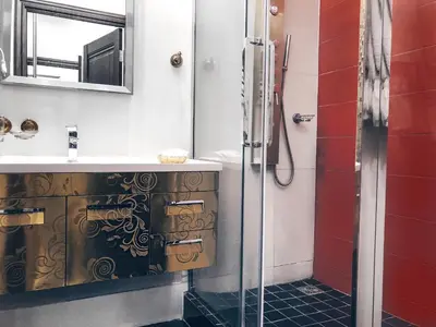 a bathroom with a sink and a shower at Baltazaras in Vilnius