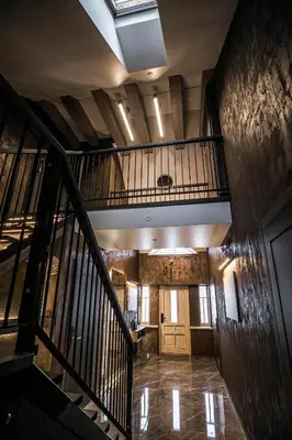 an overhead view of a staircase in a building at Senamiesčio apartamentai in Anykščiai
