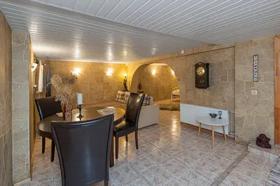 a living room with a table and a dining room at Spacious Studio apartment by Polo apartments in Kaunas