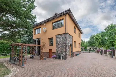a building on a brick road in front at Spacious Studio apartment by Polo apartments in Kaunas