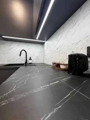 a room with a sink and a counter with a sink at Hygge Apartments in Druskininkai