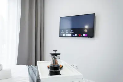 a coffee maker sitting on a table in a room at 2BD,Terrace, AC, next to Dineika Park, Brand NEW, by Cohost in Druskininkai