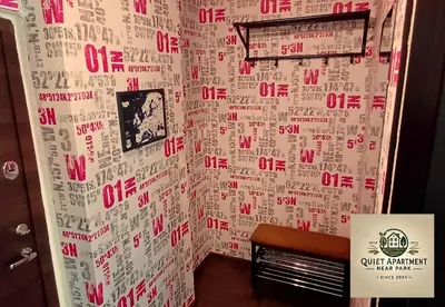 a wall with red and white writing on it at Quiet apartment near park SELF CHECK IN in Šiauliai