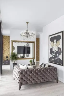 a living room with a couch and a chandelier at City center in Kaunas