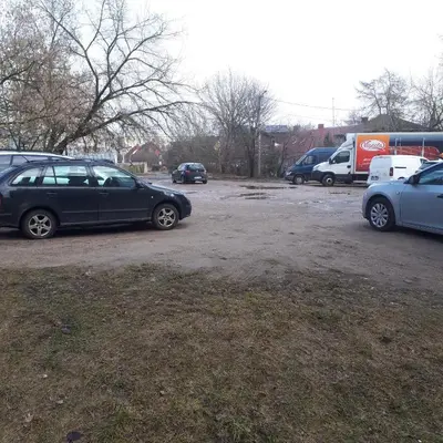 a group of parked cars in a parking lot at Mini apart Žvėrynas in Vilnius
