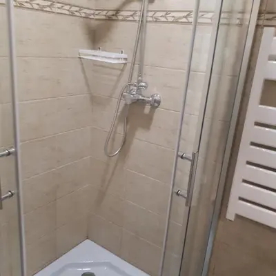 a bathroom with a shower with a toilet at Mini apart Žvėrynas in Vilnius