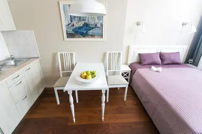 a room with a table with a bowl of fruit on it at G-45 in Vilnius