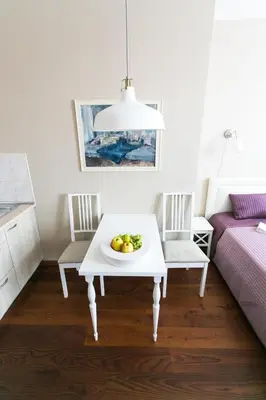 a room with a table with a bowl of fruit on it at G-45 in Vilnius