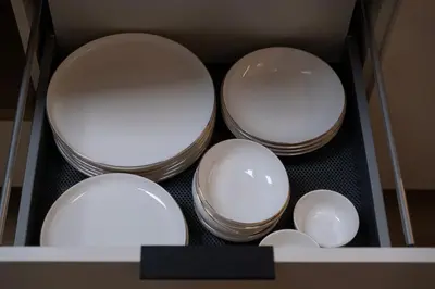 three bowls in a box on a shelf at Butas-loftas mieste, Kaunas in Kaunas