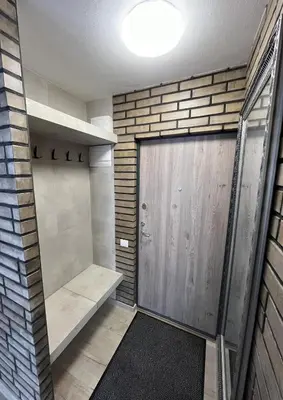 a walk in shower with a wooden door at Naujai įrengtas butas trumpalaikei nuomai in Šiauliai