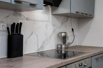 a kitchen with a mixer on a counter top at Stylish Apartment For up to 4 Guests With WiFi, Free Parking in Vilkaviškis