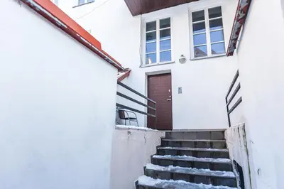 a stairway leading up to a house with a door at Central apartments 2 x Free Parking x SELF CHECK-IN 24h by H&H in Vilnius