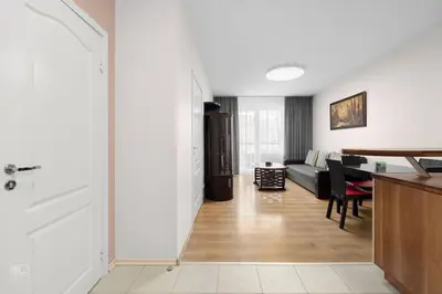 a living room with a couch and a table at Apartment with cozy balcony by URBAN RENT in Kaunas