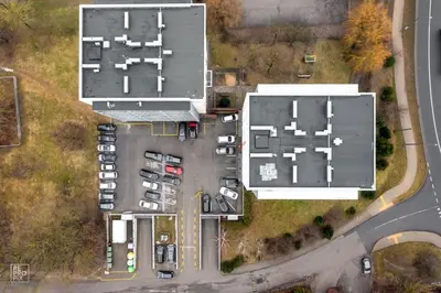an overhead view of a parking lot with buildings at Apartment with cozy balcony by URBAN RENT in Kaunas