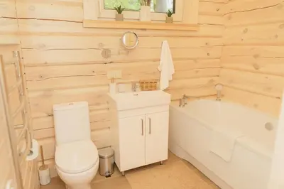 a bathroom with a toilet and a sink and a tub at 
