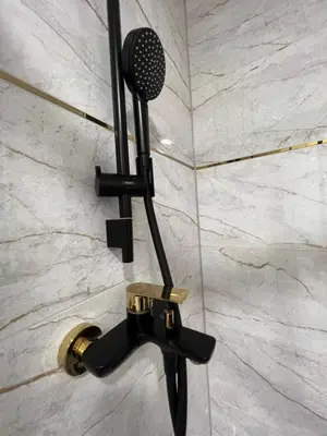 a microphone on a wall in a shower at Apartamentai JOLA in Vilkaviškis
