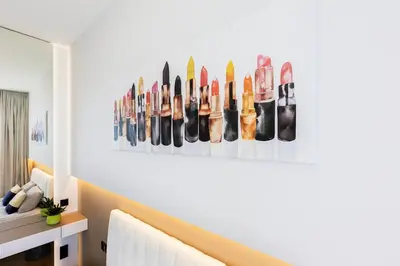 a row of shoes hanging on a wall at Brand New Central Panorama (SELF CHECK-IN) in Vilnius