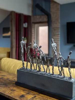 a metal fence on top of a wooden table at Cozy Penthouse in Vilnius