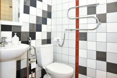 a bathroom with a toilet and a sink at Natalex MicroLofts in Vilnius