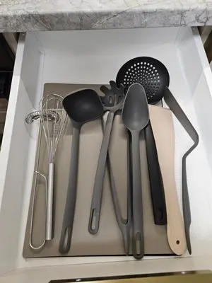 a drawer filled with utensils in a kitchen at Pleasant stay 1-bedroom apartment in Šiauliai