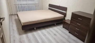 a small bedroom with a bed and a dresser at Cute Flat in Kėdainiai