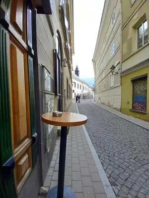 a small table sitting on the side of a street at MAIRONIO gt 19-7 in Vilnius